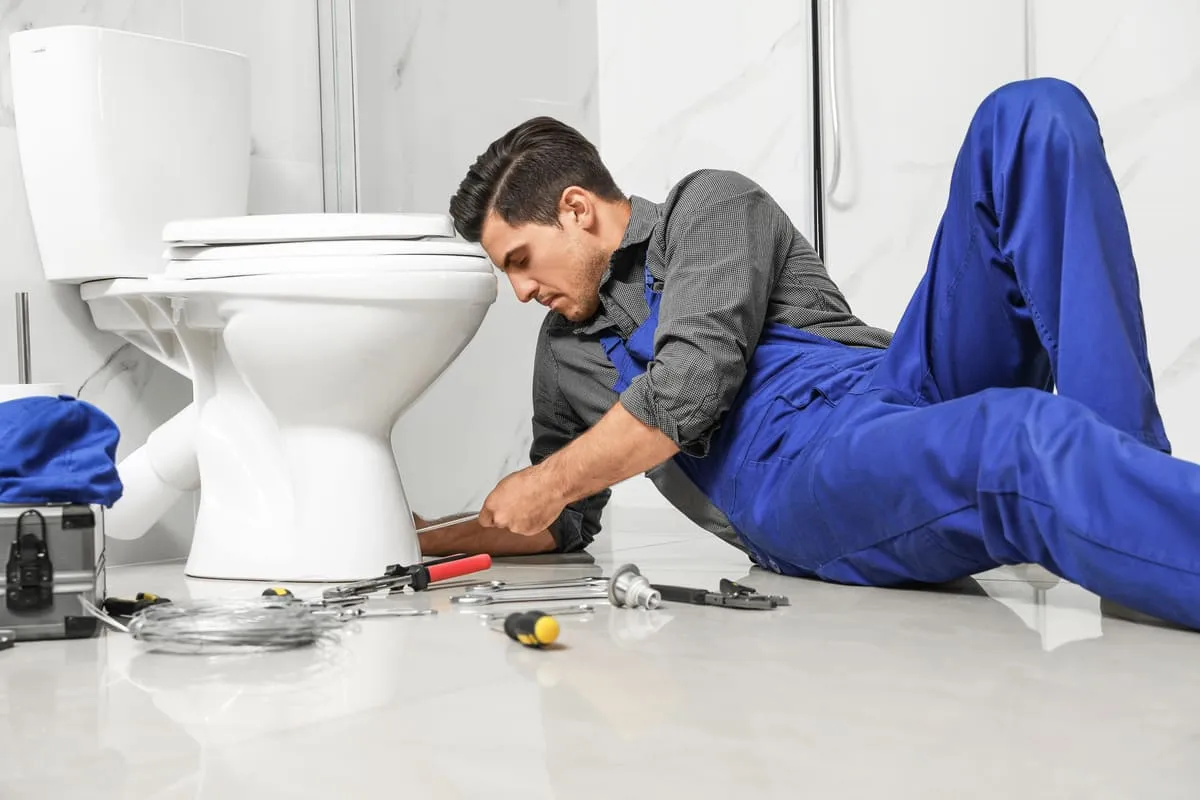 plumber-fixing-toilet